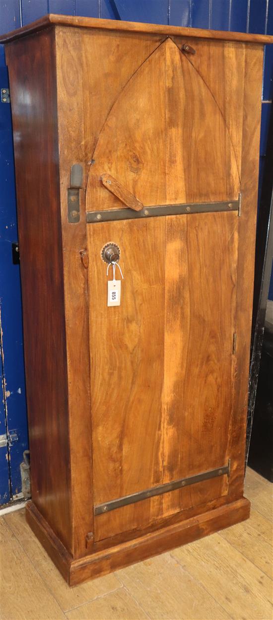 An Eastern hardwood cupboard, lancet shaped door enclosing shelves H.145cm